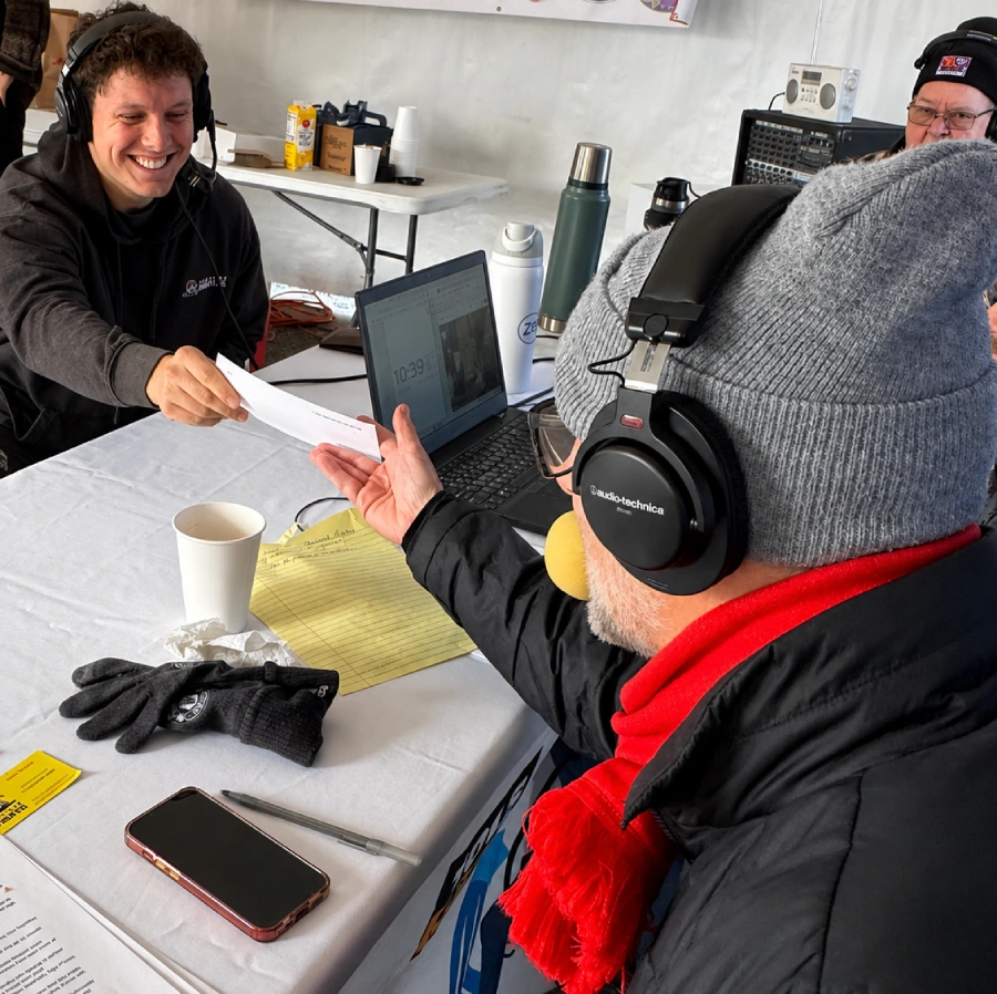 A Junk Pirates crew member being interviewed on a local podcast about junk removal.